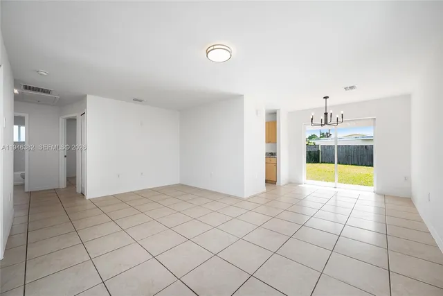 a view of an empty room and window