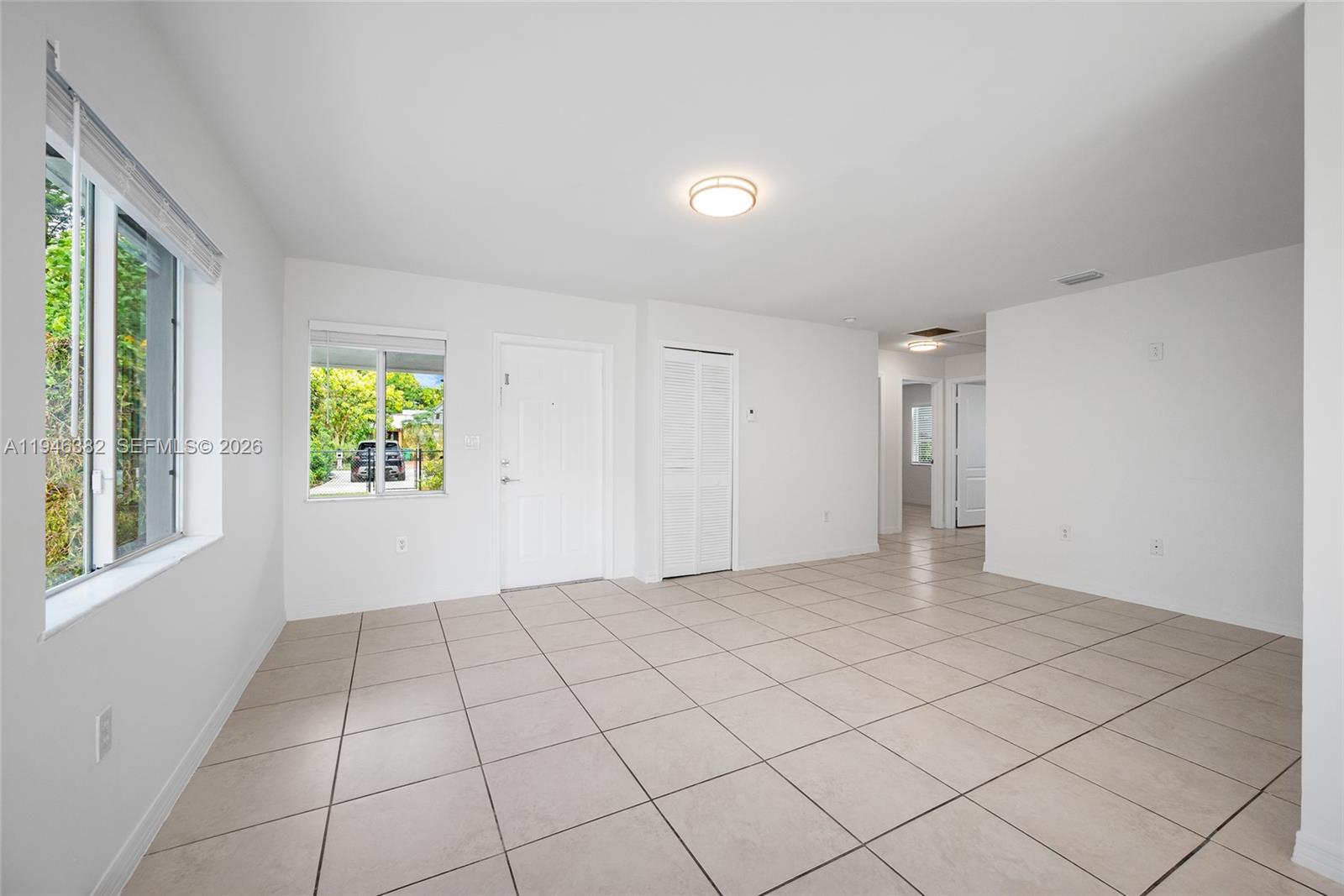 2275 Southwest 61st Avenue Miami, FL 33155 - Photo 7 of 53 a view of an empty room and window