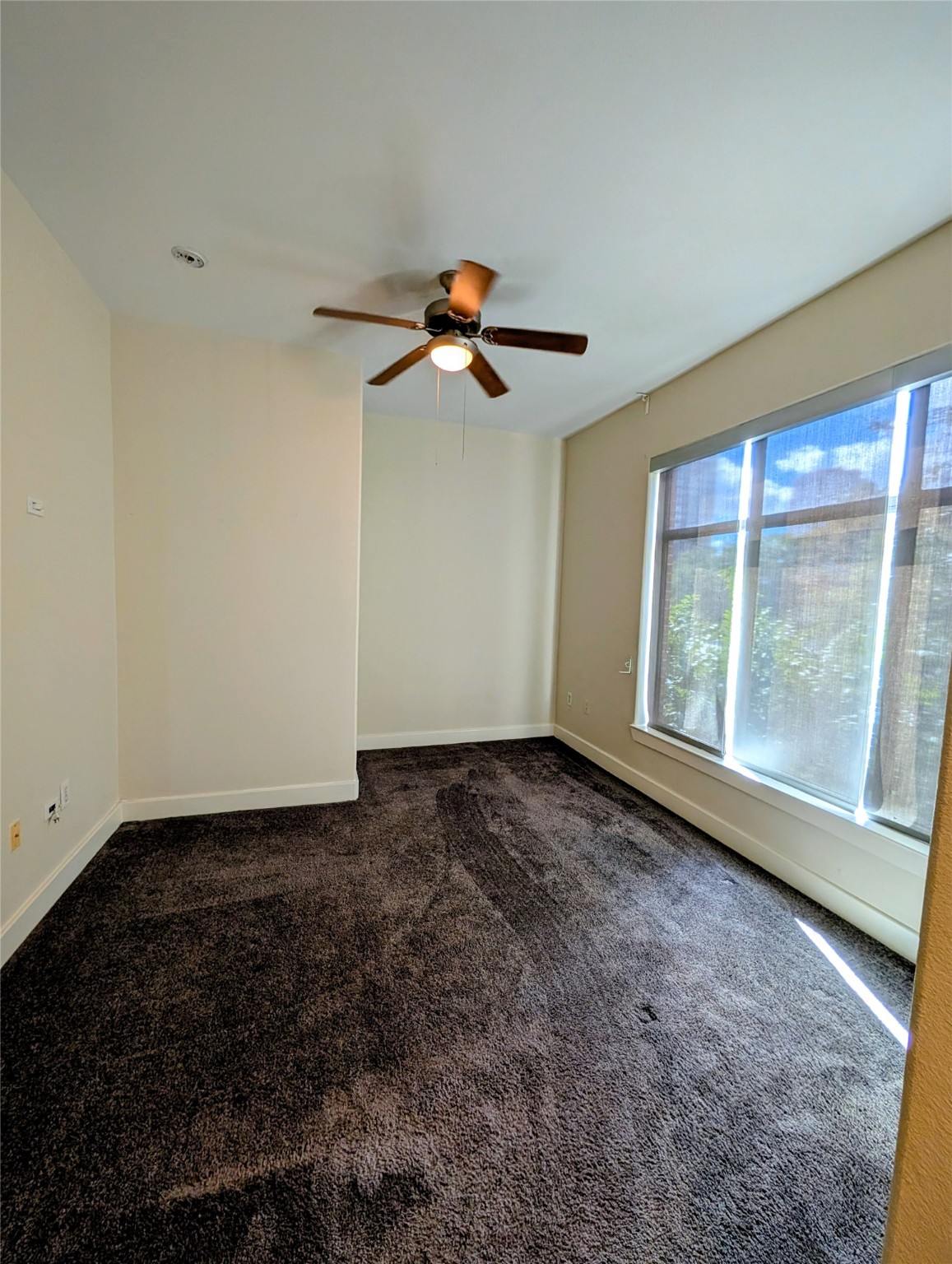 1901 Post Oak Boulevard, Unit 3101 Houston, TX 77056 - Photo 11 of 22 a view of a ceiling fan and a rug