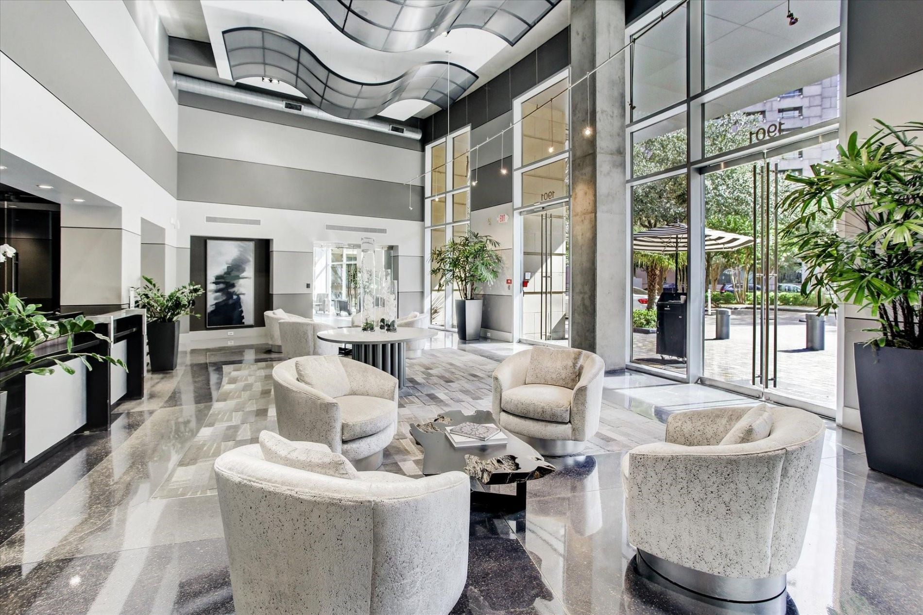 1901 Post Oak Boulevard, Unit 3101 Houston, TX 77056 - Photo 21 of 22 a living room with furniture and a large window