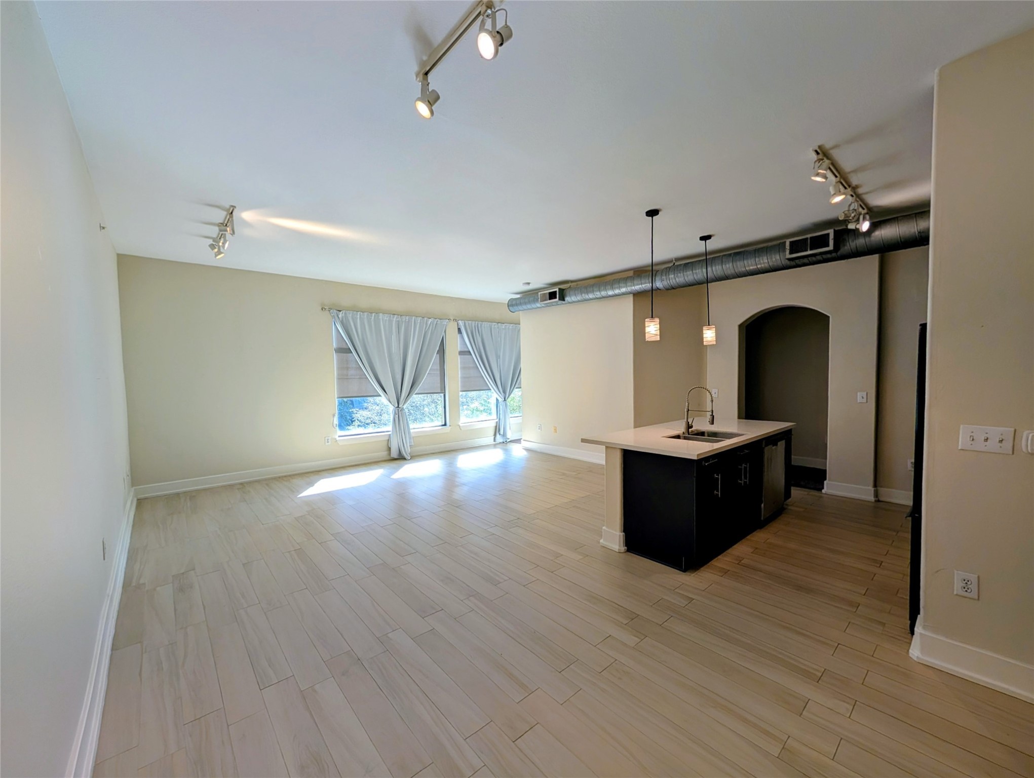 1901 Post Oak Boulevard, Unit 3101 Houston, TX 77056 - Photo 5 of 22 a living room with furniture window and wooden floor