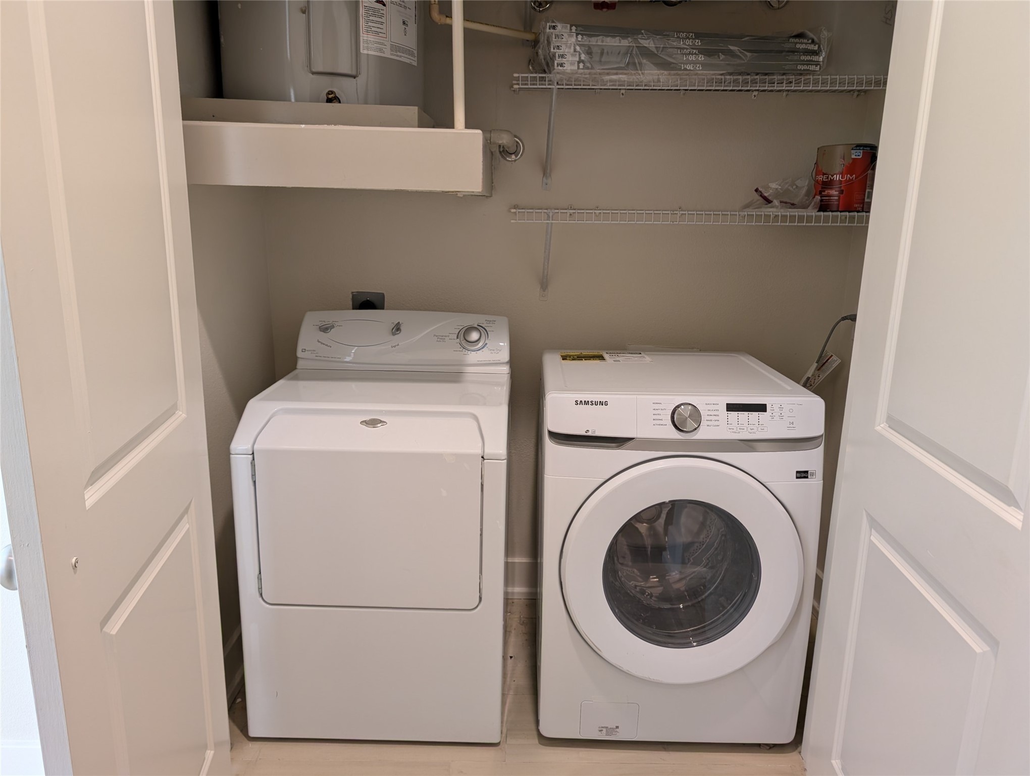 1901 Post Oak Boulevard, Unit 3101 Houston, TX 77056 - Photo 9 of 22 a utility room with dryer and washer