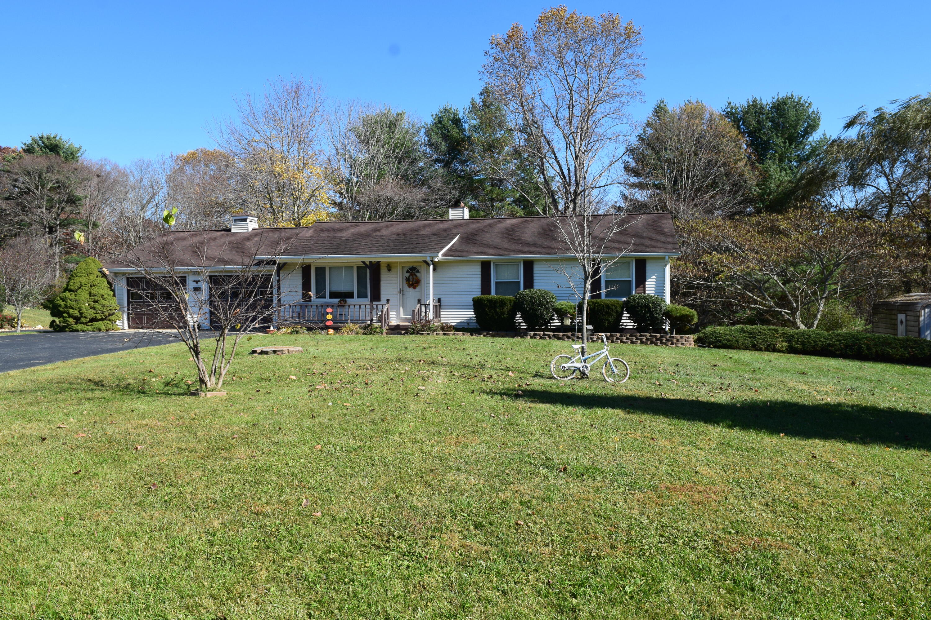 695 Long Level Road Southwest Floyd, VA 24091 - Photo 1 of 55 a front view of a house with a yard table and chairs
