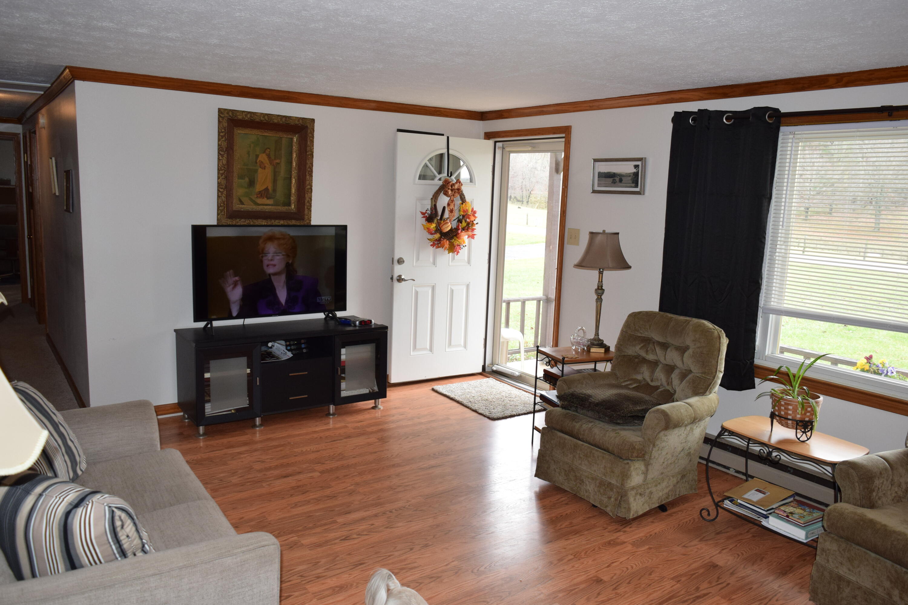 695 Long Level Road Southwest Floyd, VA 24091 - Photo 18 of 55 a living room with furniture and a flat screen tv