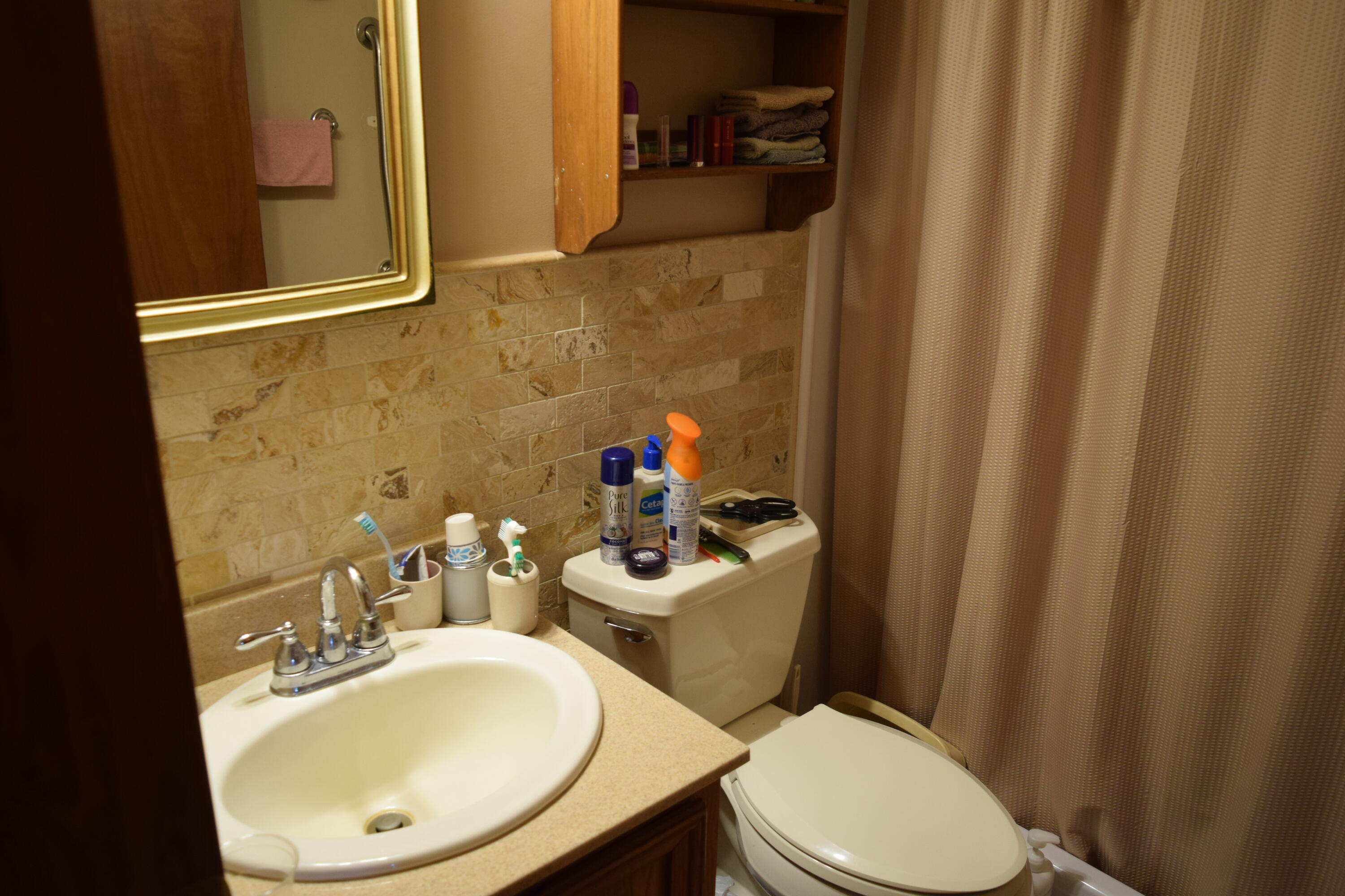 695 Long Level Road Southwest Floyd, VA 24091 - Photo 28 of 55 a white toilet sitting next to a bathroom sink