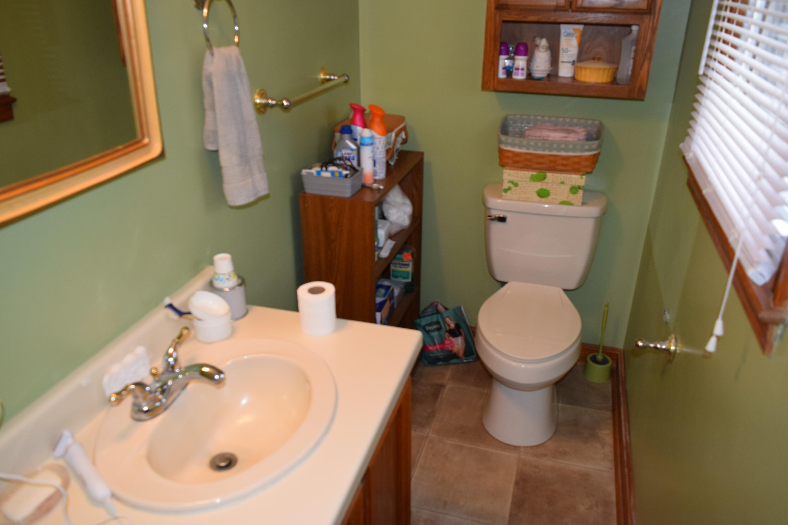 695 Long Level Road Southwest Floyd, VA 24091 - Photo 36 of 55 a bathroom with a toilet sink and mirror