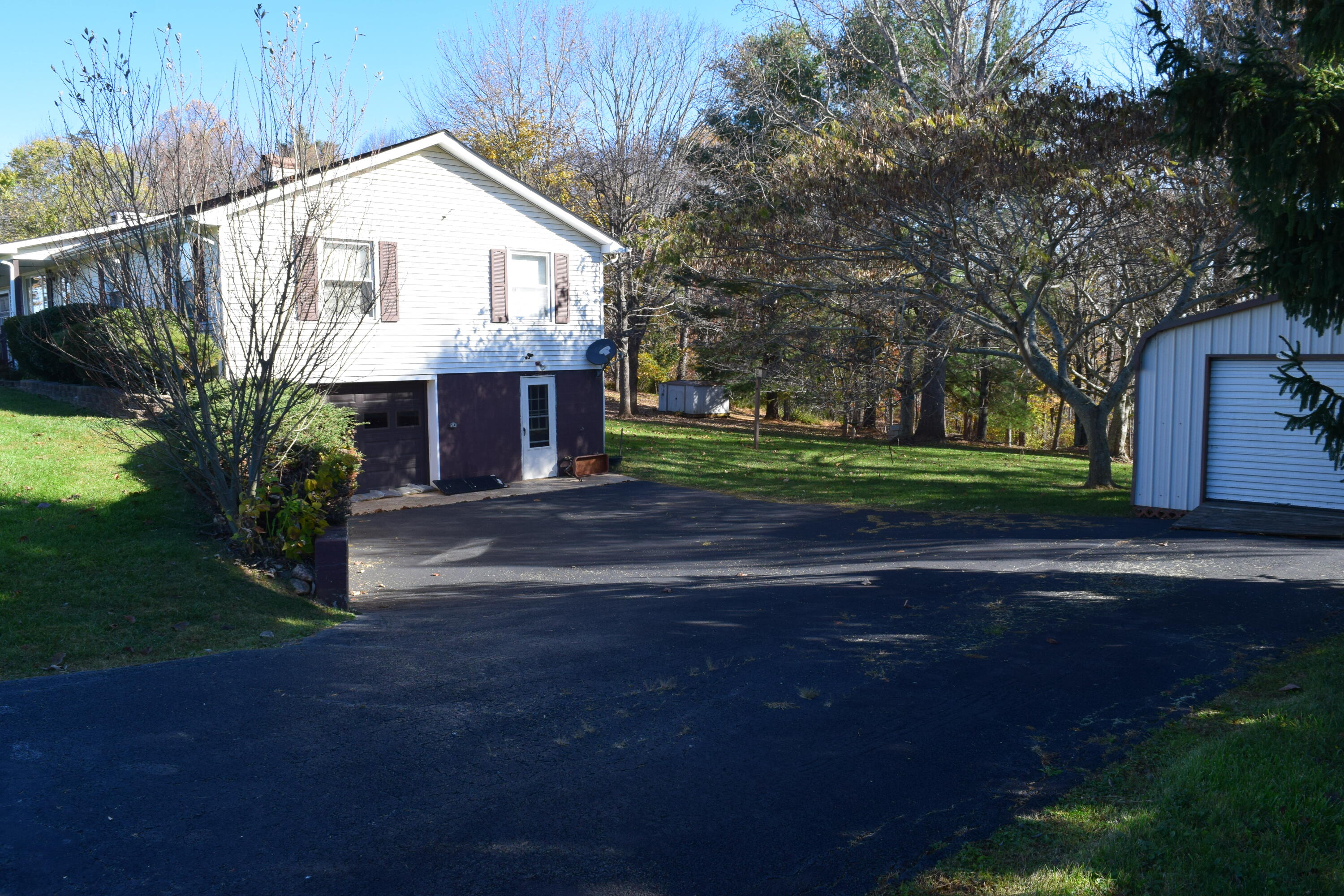 695 Long Level Road Southwest Floyd, VA 24091 - Photo 10 of 55 a front view of a house with a yard and trees