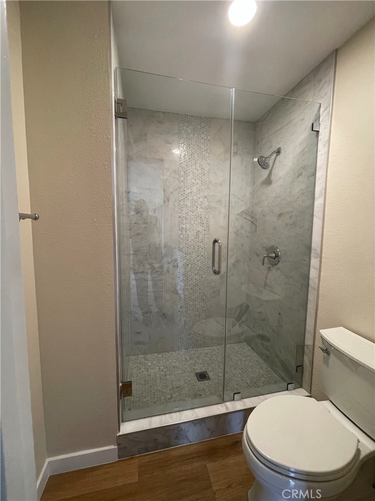 23 Sunfish, Unit 33 Irvine, CA 92604 - Photo 12 of 32 a white toilet next to a bathroom