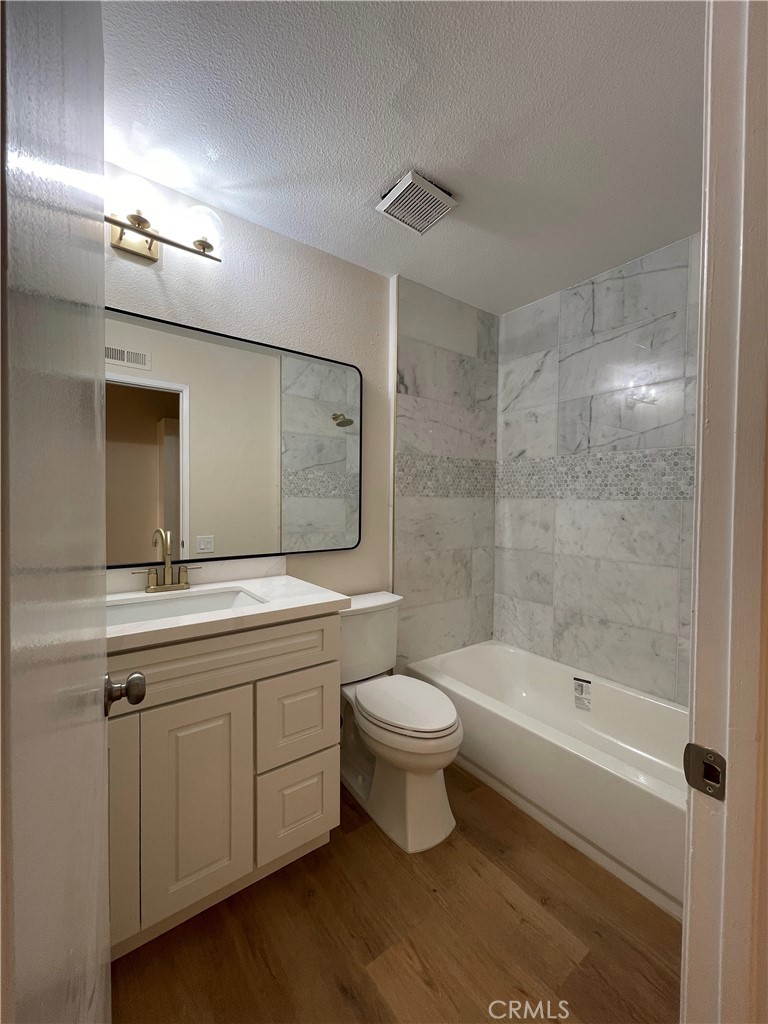 23 Sunfish, Unit 33 Irvine, CA 92604 - Photo 14 of 32 a bathroom with a double vanity sink toilet and shower