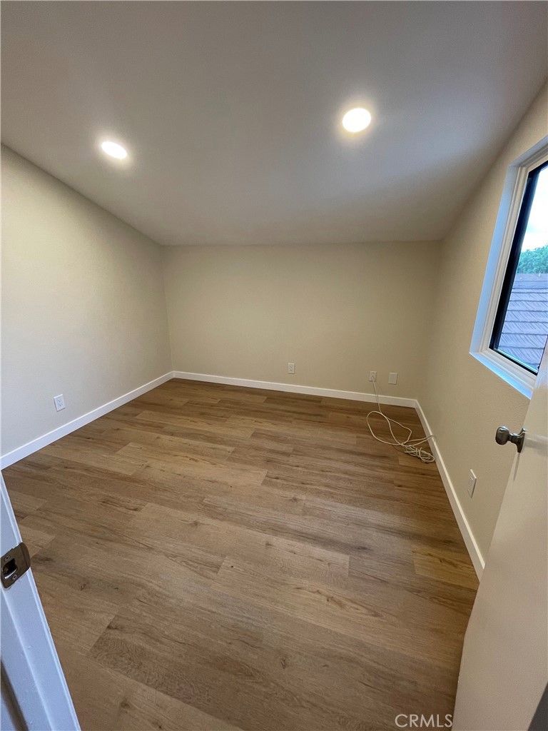 23 Sunfish, Unit 33 Irvine, CA 92604 - Photo 15 of 32 wooden floor in an empty room with a window