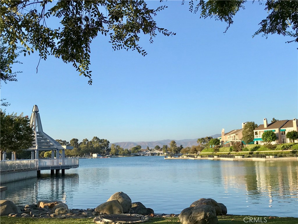 23 Sunfish, Unit 33 Irvine, CA 92604 - Photo 25 of 32 a view of a lake with boats and trees in the background