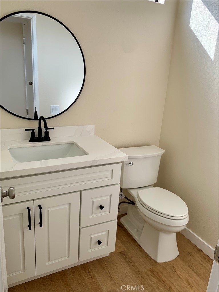 23 Sunfish, Unit 33 Irvine, CA 92604 - Photo 6 of 32 a bathroom with a sink mirror vanity and toilet