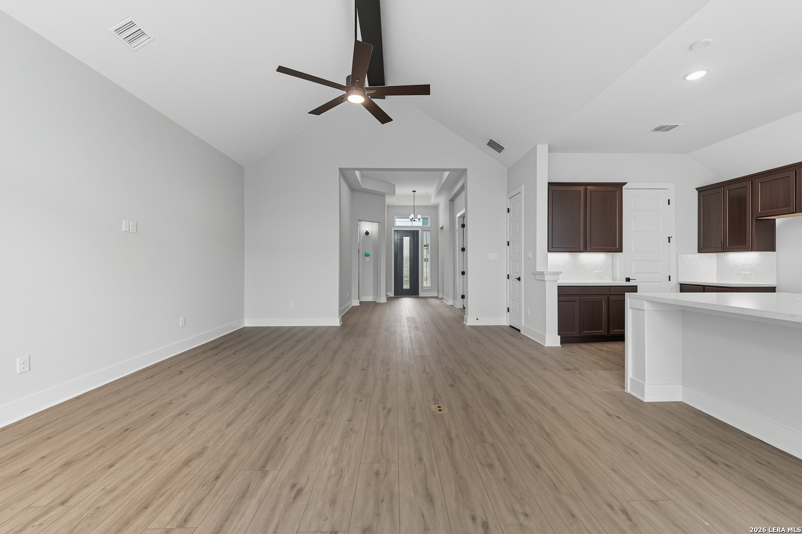 210 Kari Drive Castroville, TX 78009 - Photo 12 of 29 a view of a livingroom with wooden floor and a flat screen tv