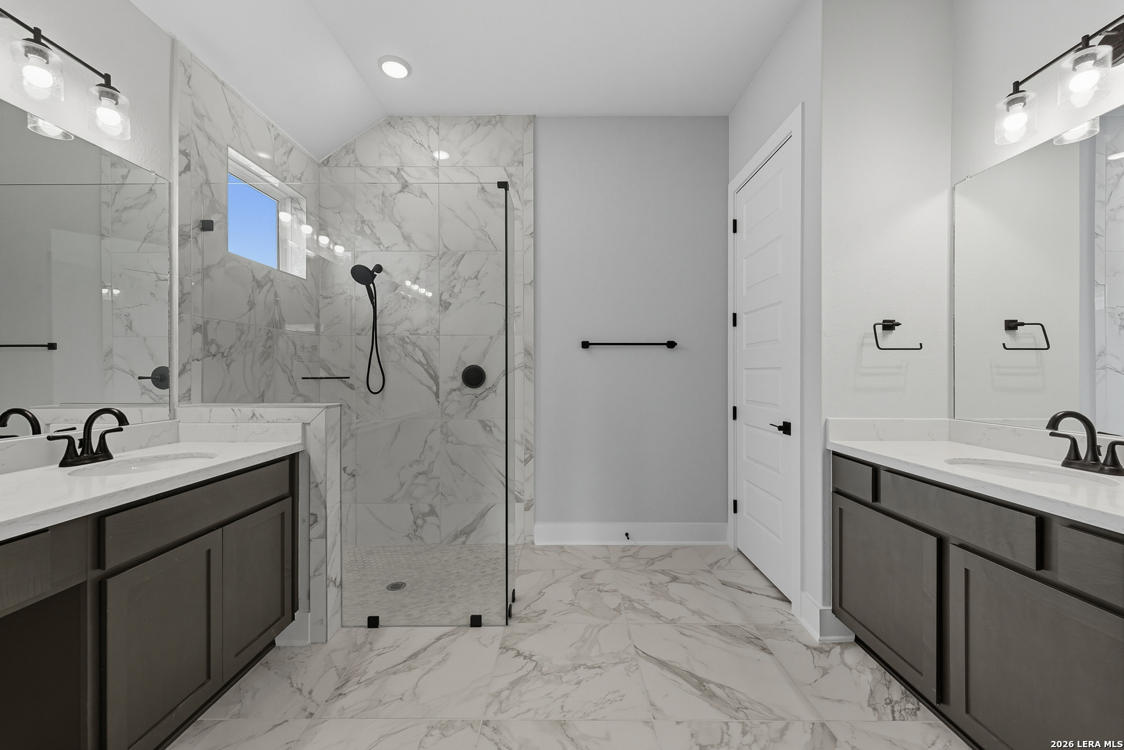 210 Kari Drive Castroville, TX 78009 - Photo 18 of 29 a spacious bathroom with a shower sink and mirror