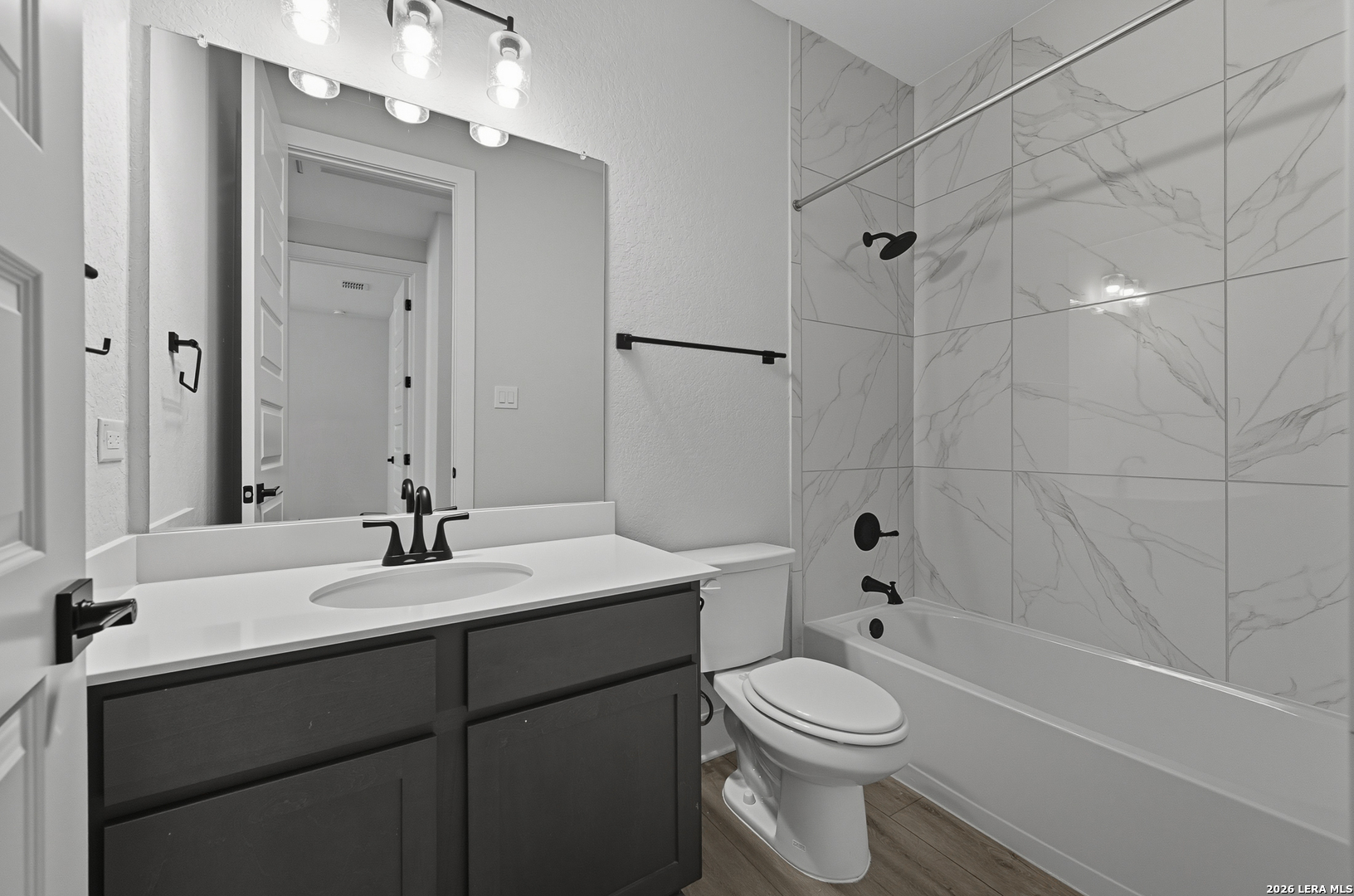 210 Kari Drive Castroville, TX 78009 - Photo 4 of 29 a bathroom with a sink a toilet and shower