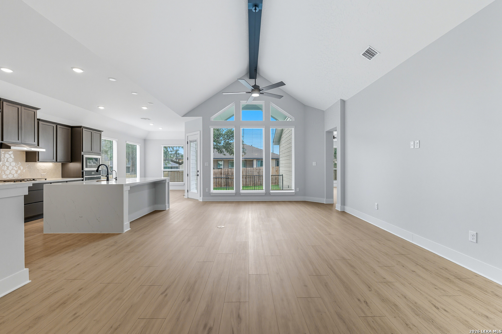 210 Kari Drive Castroville, TX 78009 - Photo 9 of 29 a view of a kitchen with furniture wooden floor and windows