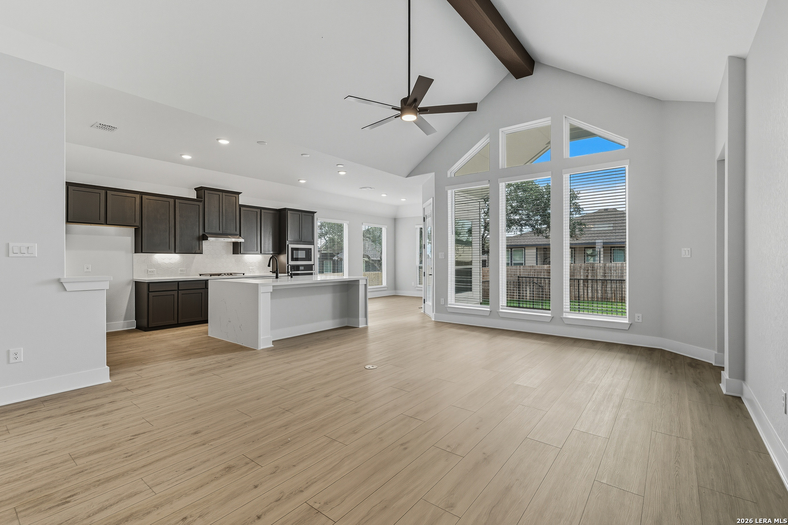 210 Kari Drive Castroville, TX 78009 - Photo 10 of 29 a view of a kitchen with a sink cabinets and wooden floor
