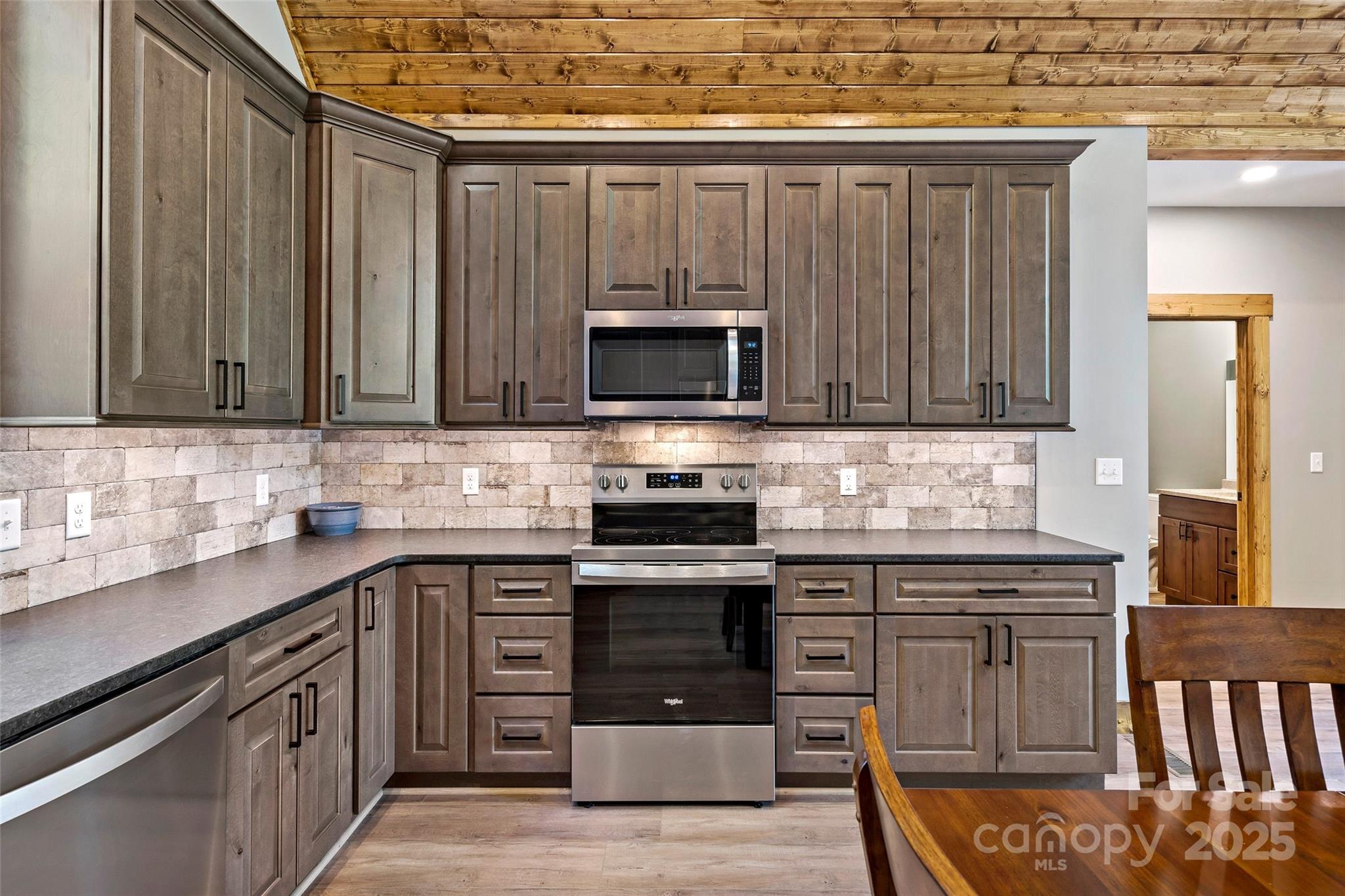 23 Laurel Crest Lane Mill Spring, NC 28756 - Photo 11 of 46 a kitchen with stainless steel appliances granite countertop a stove and a sink