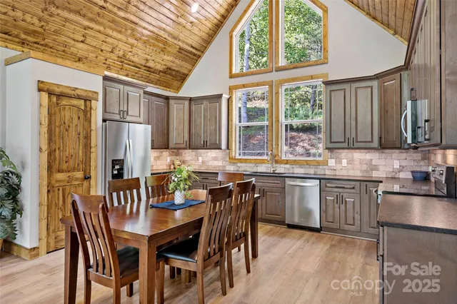 a large bed sitting in a bedroom next to a window