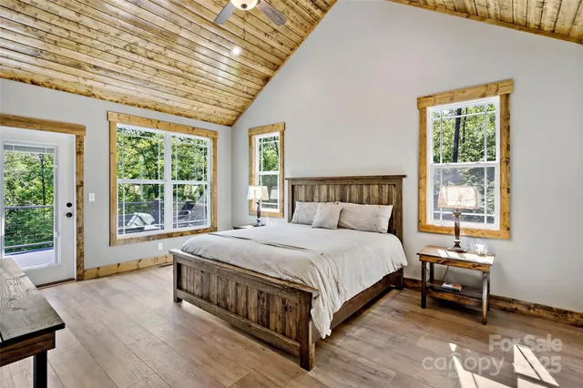 a bed sitting in a bedroom next to a window