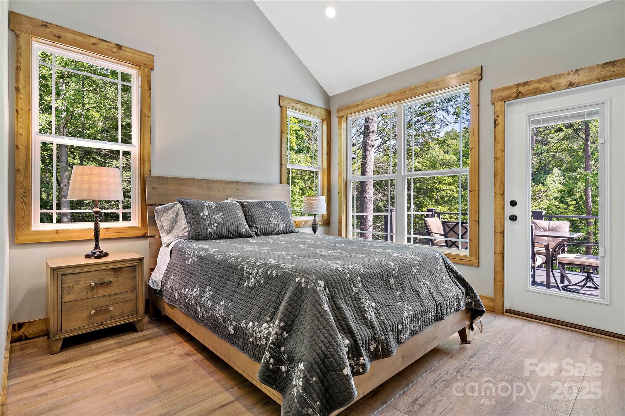 23 Laurel Crest Lane Mill Spring, NC 28756 - Photo 19 of 46 a bed sitting in a bedroom next to a window