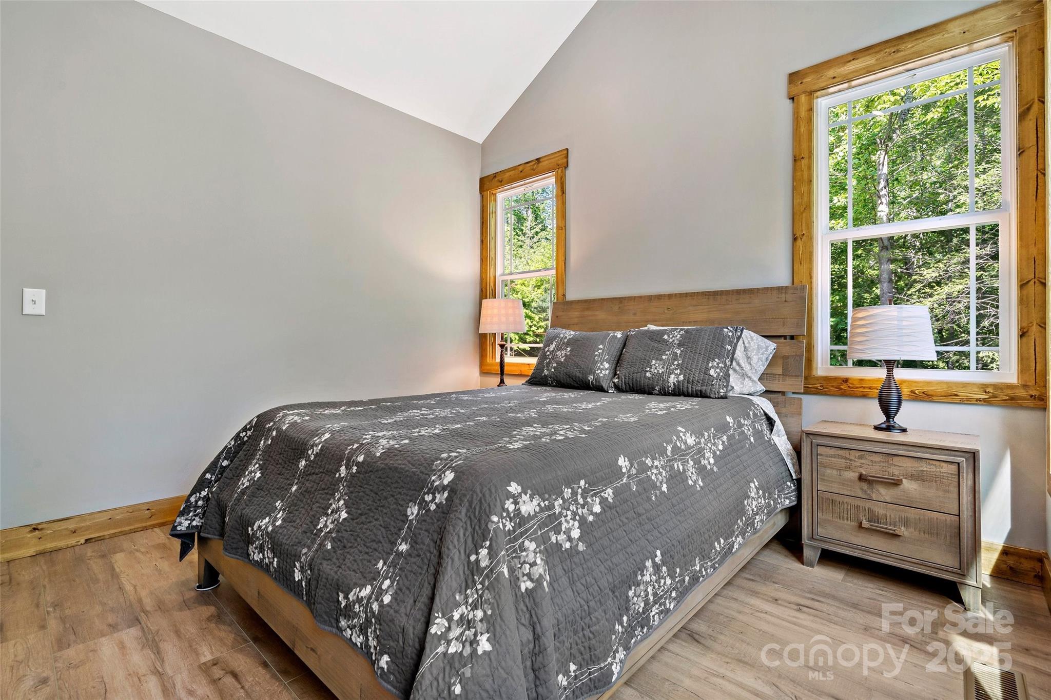 23 Laurel Crest Lane Mill Spring, NC 28756 - Photo 20 of 46 a bedroom with a bed and a window