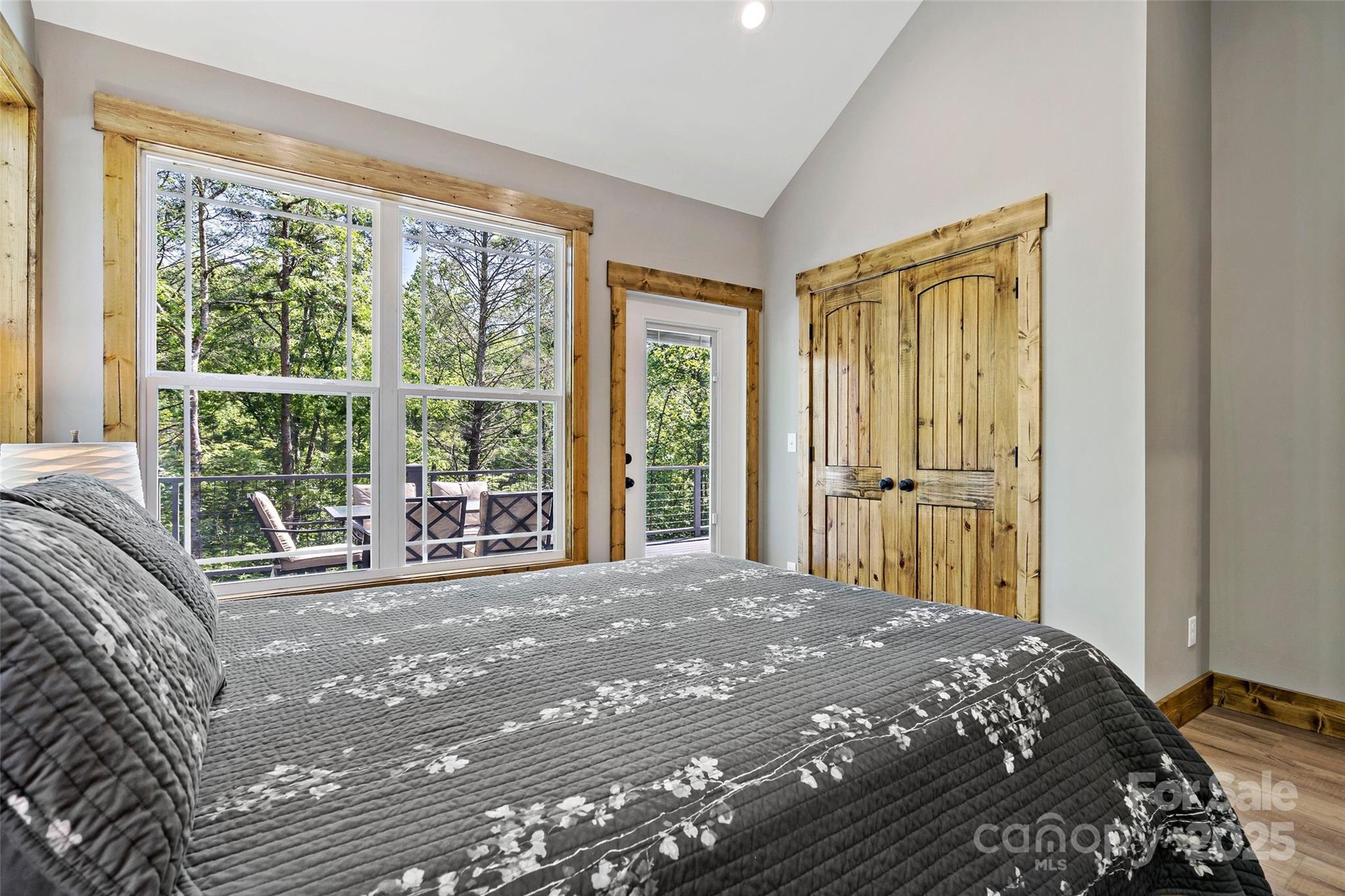 23 Laurel Crest Lane Mill Spring, NC 28756 - Photo 21 of 46 a bedroom with a bed and a large window