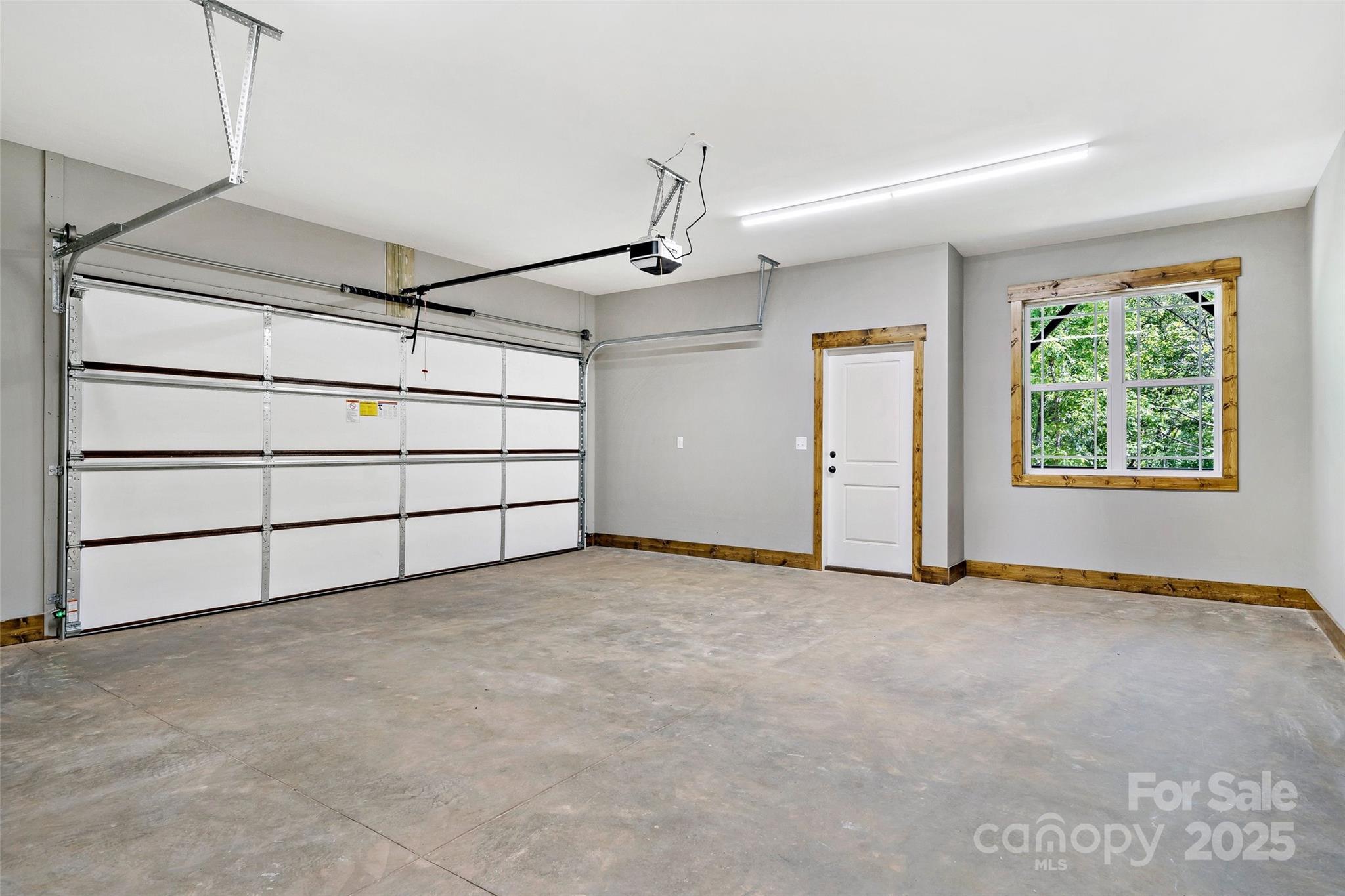 23 Laurel Crest Lane Mill Spring, NC 28756 - Photo 33 of 46 an empty room with windows and cabinet