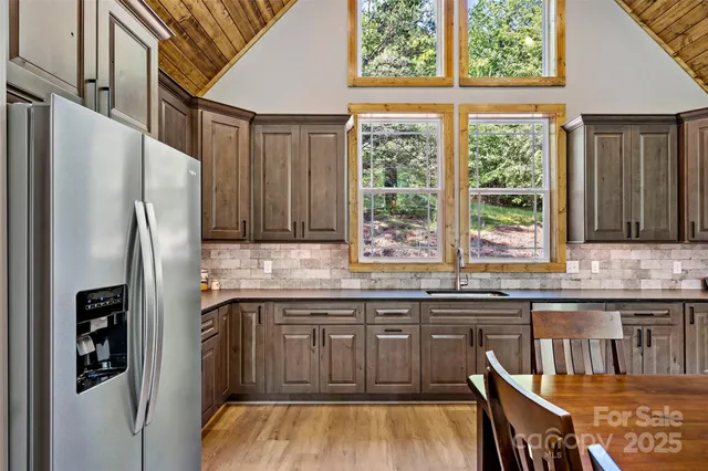 a kitchen with stainless steel appliances granite countertop a stove and a sink