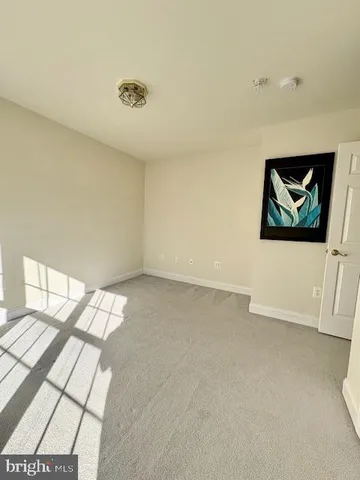 a spacious bathroom with a sink a toilet and a window