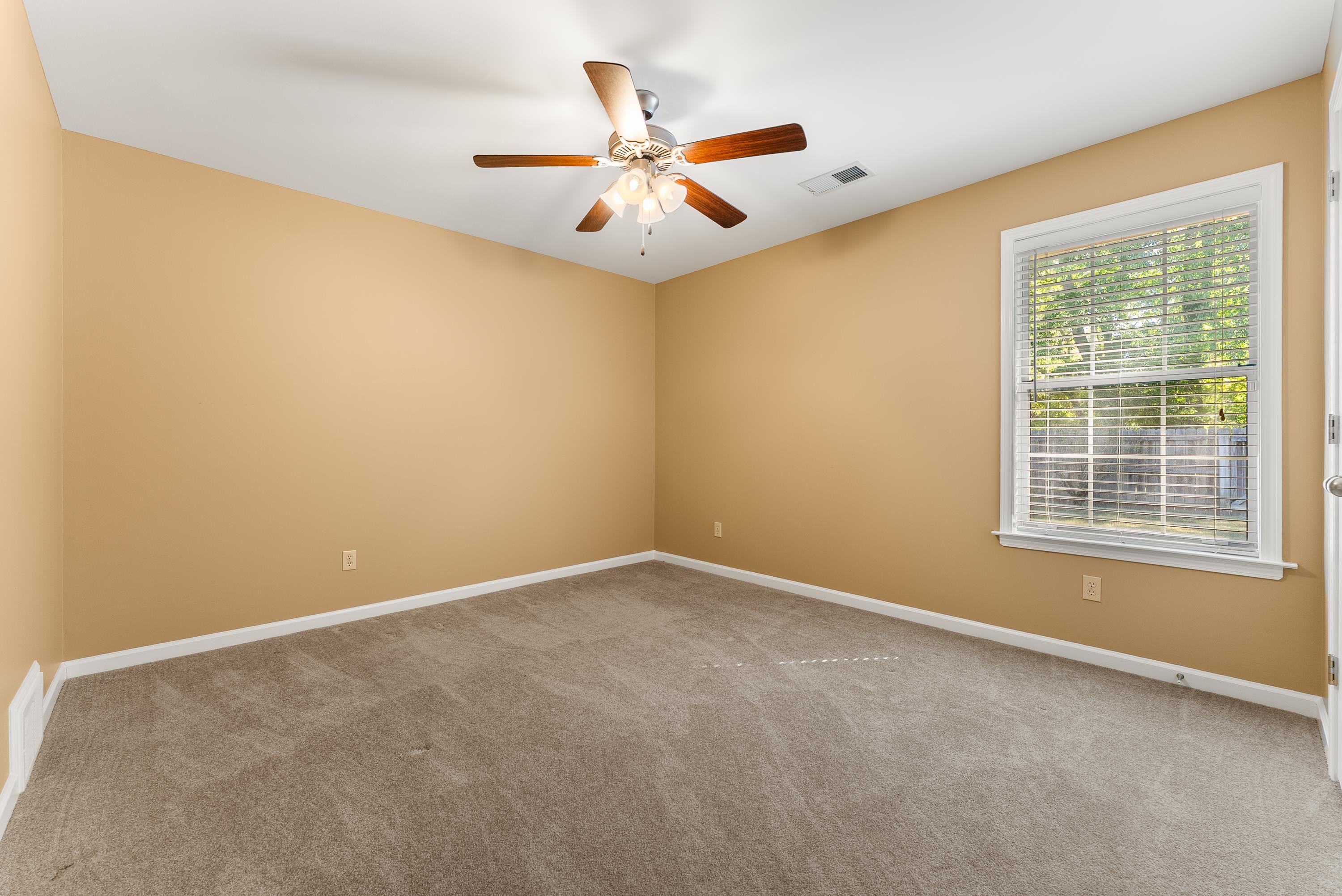 978 Sugar Lane Collierville, TN 38017 - Photo 11 of 14 an empty room with window and ceiling fan
