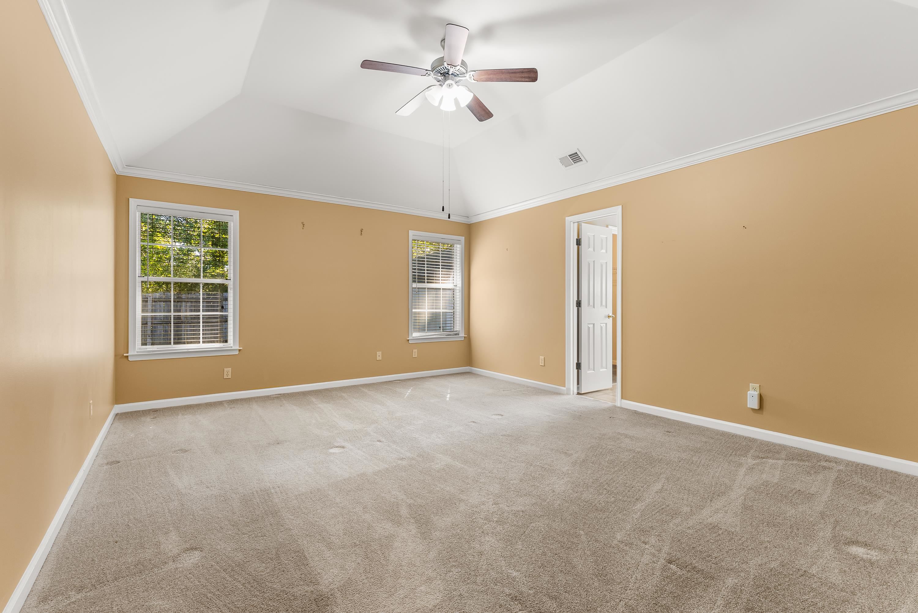 978 Sugar Lane Collierville, TN 38017 - Photo 7 of 14 an empty room with windows and fan