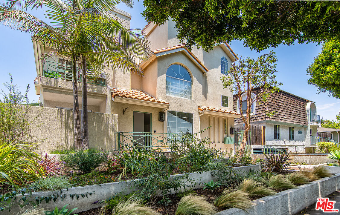 2333 Oak Street, Unit 2 Santa Monica, CA 90405 - Photo 1 of 30 a view of a brick house with a large windows and flower plants