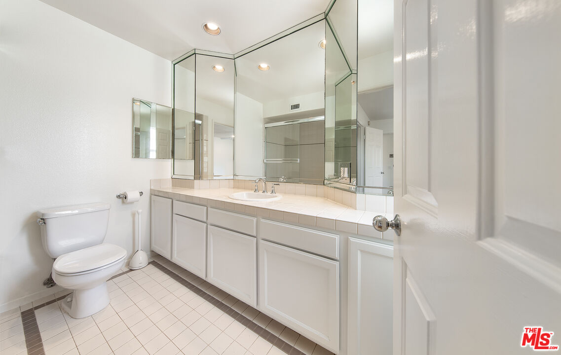 2333 Oak Street, Unit 2 Santa Monica, CA 90405 - Photo 11 of 30 a bathroom with a double vanity sink toilet and shower