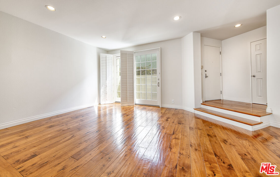 2333 Oak Street, Unit 2 Santa Monica, CA 90405 - Photo 21 of 30 a view of an empty room with wooden floor and a window