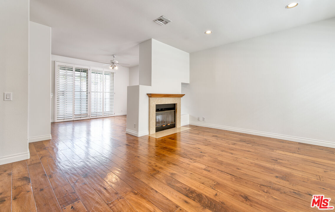 2333 Oak Street, Unit 2 Santa Monica, CA 90405 - Photo 23 of 30 a view of an empty room with wooden floor and a window