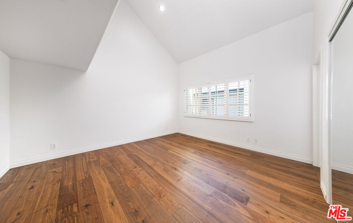 2333 Oak Street, Unit 2 Santa Monica, CA 90405 - Photo 29 of 30 an empty room with wooden floor and windows