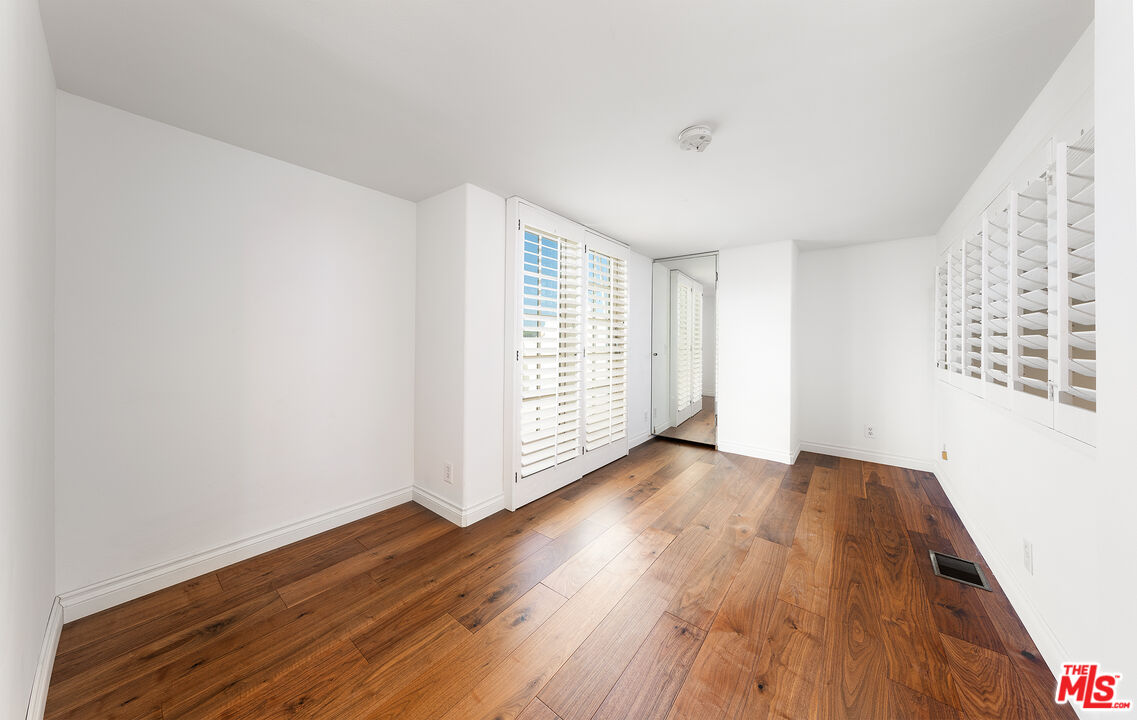2333 Oak Street, Unit 2 Santa Monica, CA 90405 - Photo 30 of 30 an empty room with wooden floor and windows