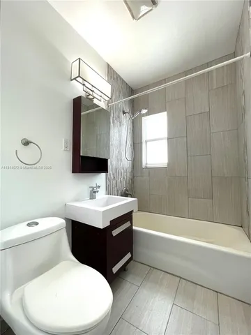 a view of a room with wooden floor and windows