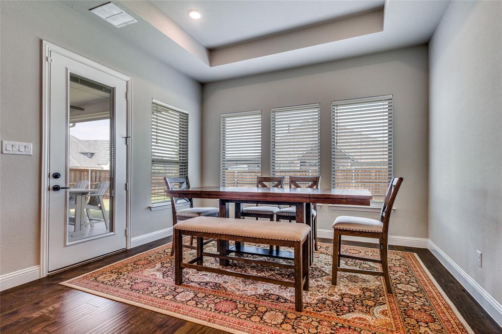 11112 Lacey Oak Ridge Flower Mound, TX 76226 - Photo 13 of 40 a view of a livingroom with furniture window and wooden floor