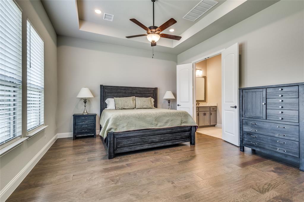 11112 Lacey Oak Ridge Flower Mound, TX 76226 - Photo 14 of 40 a bedroom with a bed and window