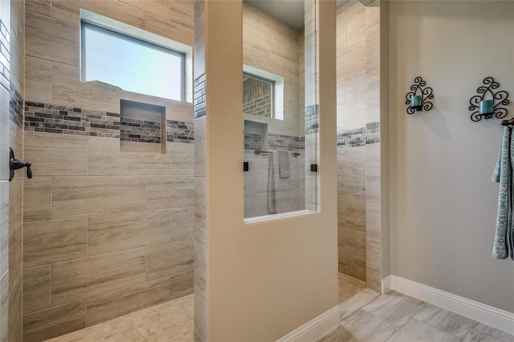 11112 Lacey Oak Ridge Flower Mound, TX 76226 - Photo 17 of 40 a bathroom with a shower