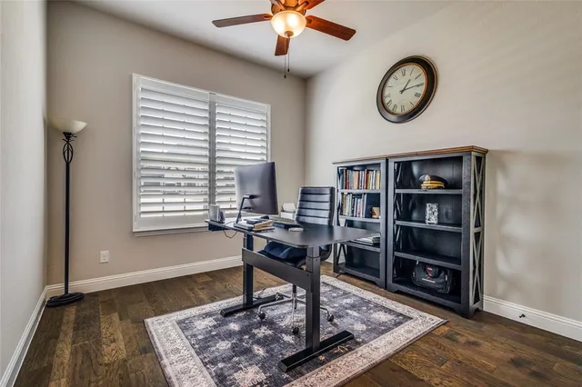 a view of a work space with furniture and a window
