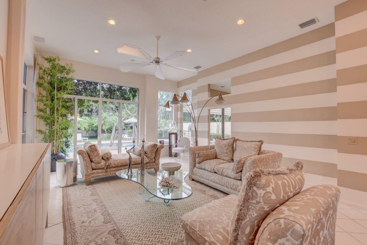 5758 Northwest 24th Terrace Boca Raton, FL 33496 - Photo 13 of 35 a living room with furniture and a large window