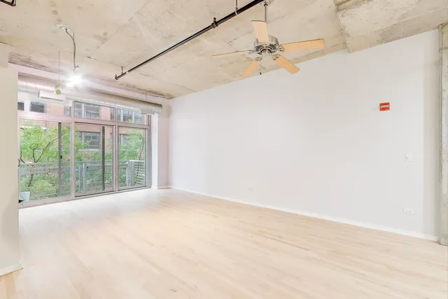 a view of a room with a large window