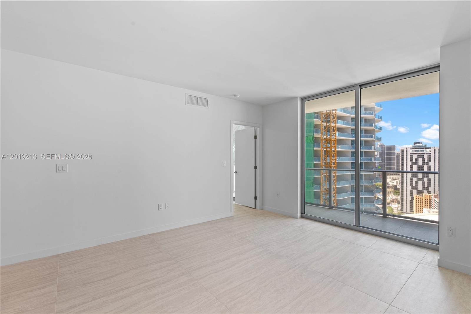 77 Southeast 5th, Unit 3702 Miami, FL 33131 - Photo 15 of 63 a view of an empty room with a window