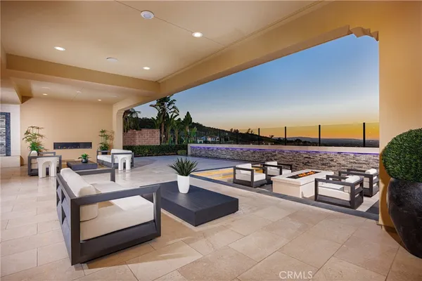 a living room with furniture a large window and a flat screen tv