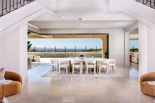a kitchen with a table chairs stove and kitchen island