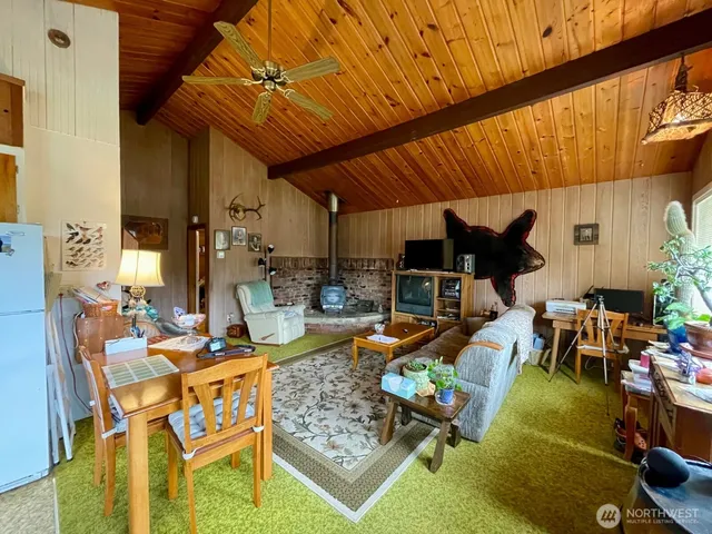 a living room with couch and a dining table