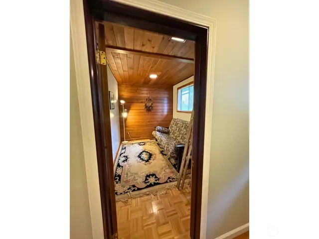 a backyard of a house with table and chairs